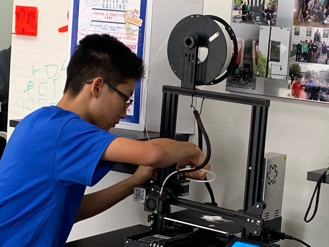 A volunteer at the 3D printer, 2019